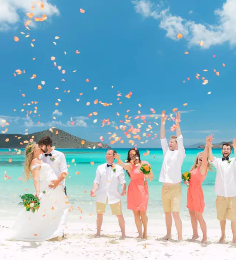 Wedding party celebrating on a Caribbean beach